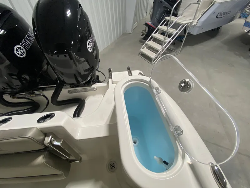 Slide: The Image of 2024 Key West 244 CC boat with dual Yamaha engines and open livewell. - 9