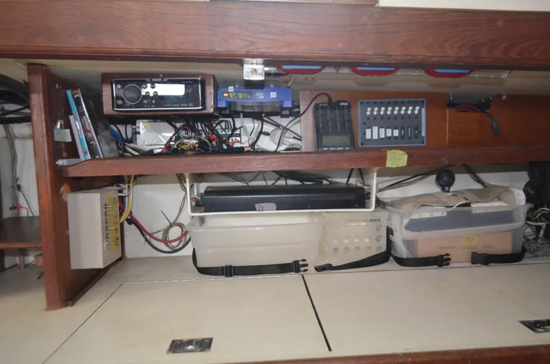 Slide: The Image of Electrical equipment and storage inside a 1973 Skookum Ketch sailboat. - 12