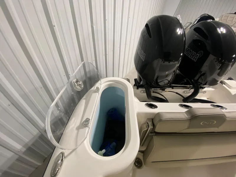 Slide: The Image of 2024 Key West 244 CC boat with dual Yamaha engines in storage. - 10