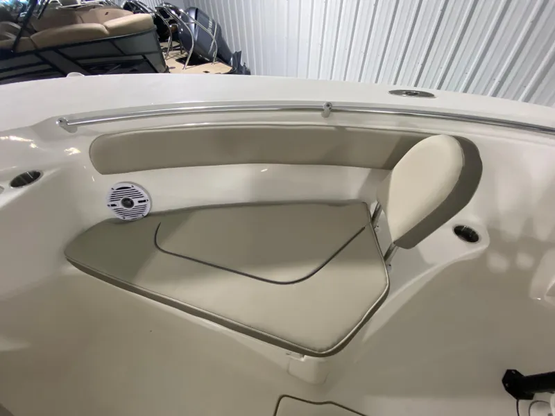 Slide: The Image of 2024 Key West 244 CC boat interior seating area with cushioned seats. - 23