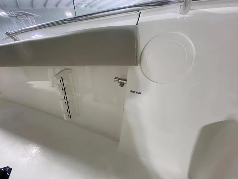 Slide: The Image of 2024 Key West 244 CC boat interior detail with fresh water access. - 25
