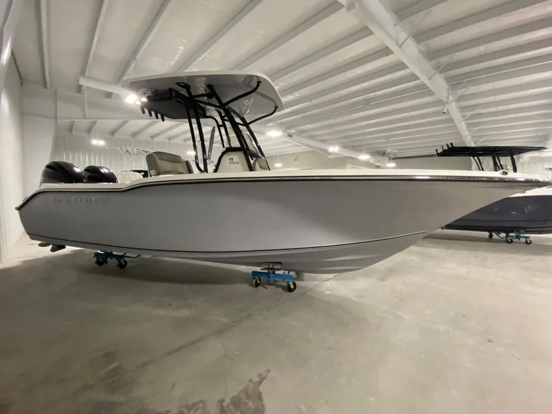 Slide: The Image of 2024 Key West 244 CC center console boat in showroom. - 3