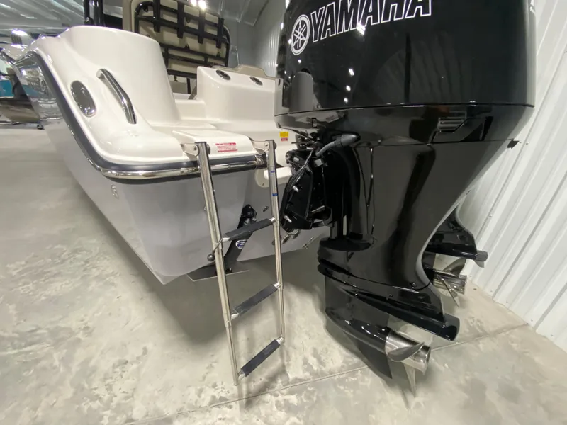 Slide: The Image of 2024 Key West 244 CC boat with Yamaha outboard motor and boarding ladder. - 5