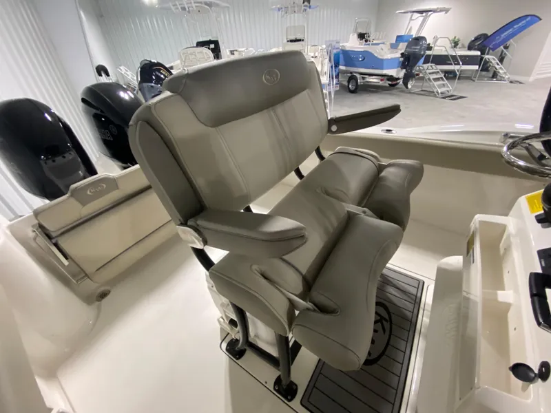 Slide: The Image of 2024 Key West 244 CC boat interior with dual captain's chairs and modern design. - 13