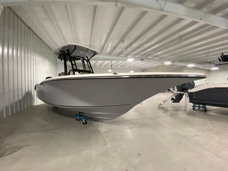 Slide: The Image of 2024 Key West 244 CC boat in indoor storage facility. - 2