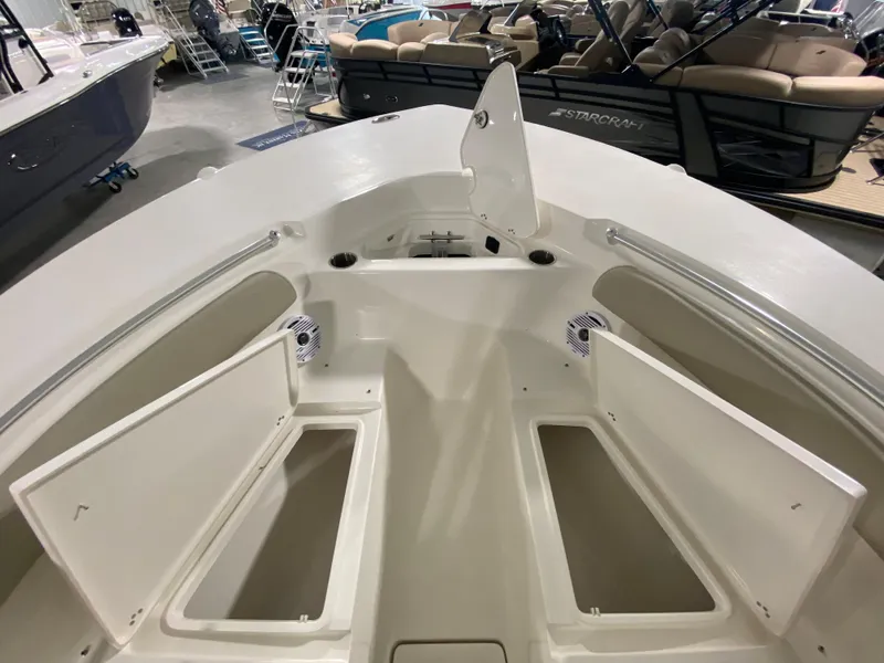 Slide: The Image of 2024 Key West 244 CC boat interior with open storage compartments. - 24