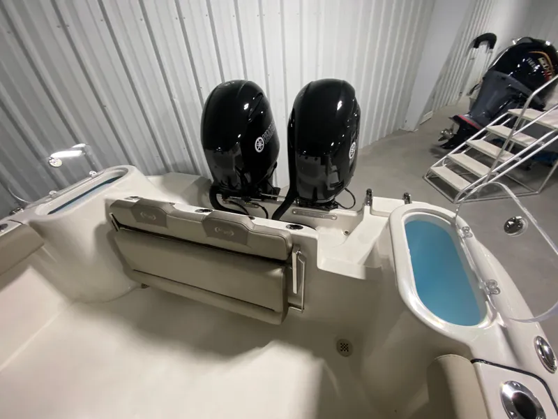 Slide: The Image of 2024 Key West 244 CC boat with twin outboard engines in storage. - 7