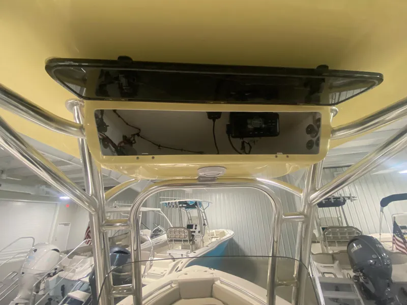 Slide: The Image of 2024 Key West 219 FS boat interior with T-top and electronics. - 13