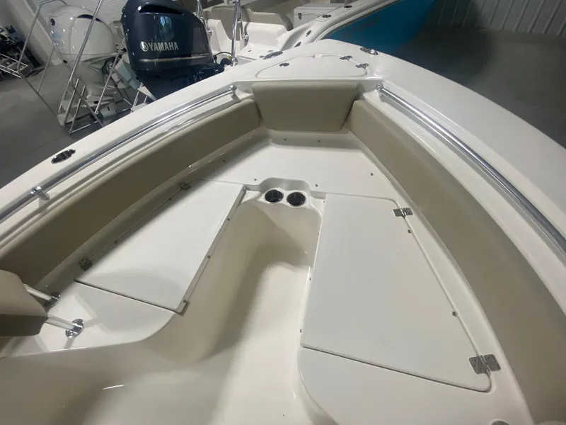 Slide: The Image of 2024 Key West 219 FS boat interior with seating and storage compartments. - 21