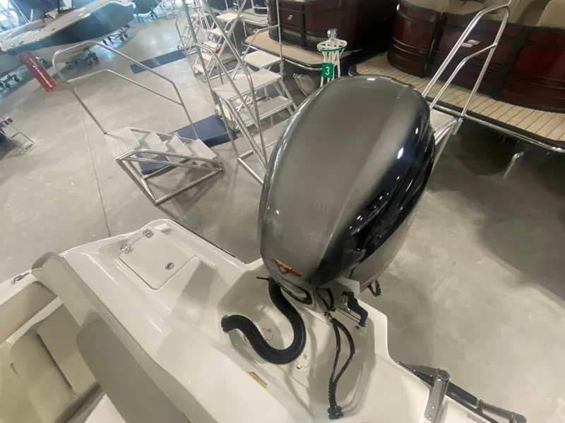 Slide: The Image of 2024 Key West 219 FS boat with outboard motor in showroom. - 4