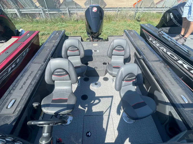 Slide: The Image of 2021 Tracker Targa V-19 WT boat interior with four seats and steering console. - 10