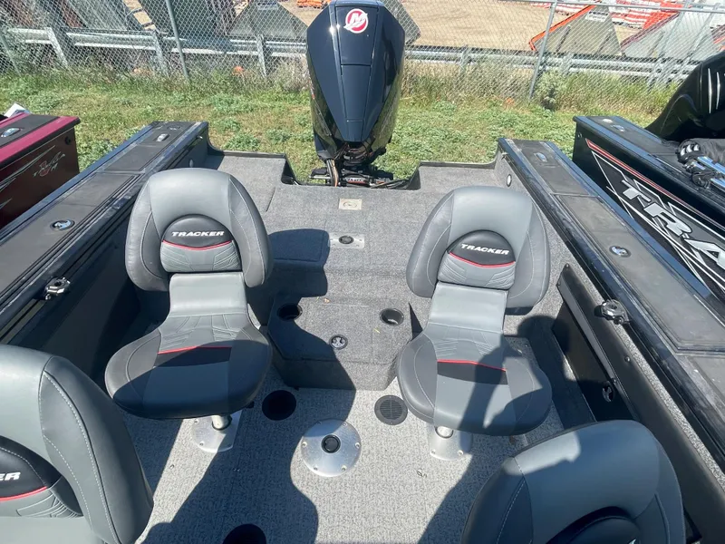 Slide: The Image of 2021 Tracker Targa V-19 WT boat interior with two seats and outboard motor. - 4