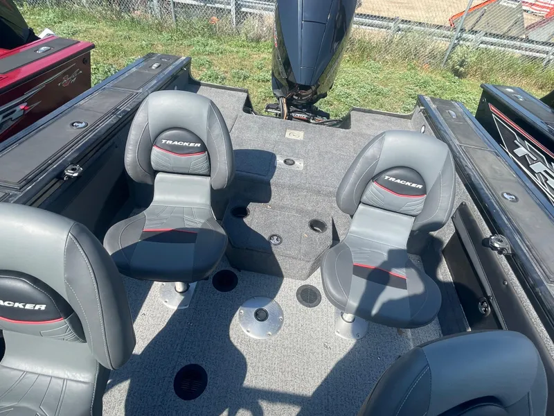 Slide: The Image of 2021 Tracker Targa V-19 WT boat interior with seating and motor. - 7