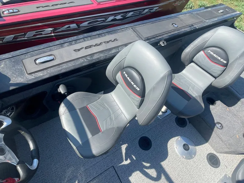 Slide: The Image of 2021 Tracker Targa V-19 WT boat interior with two grey and black seats. - 8