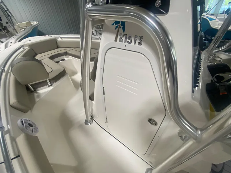 Slide: The Image of 2024 Key West 219 FS boat interior with seating and storage compartments. - 14