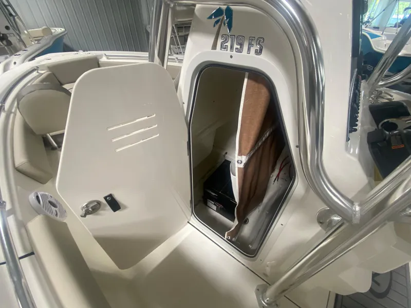 Slide: The Image of 2024 Key West 219 FS boat interior with open cabin door. - 17