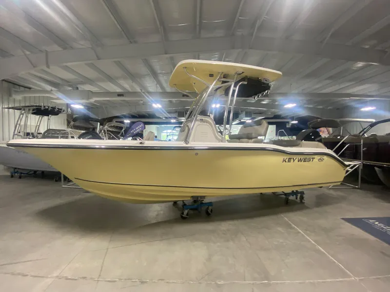 Slide: The Image of 2024 Key West 219 FS boat in showroom. - 2
