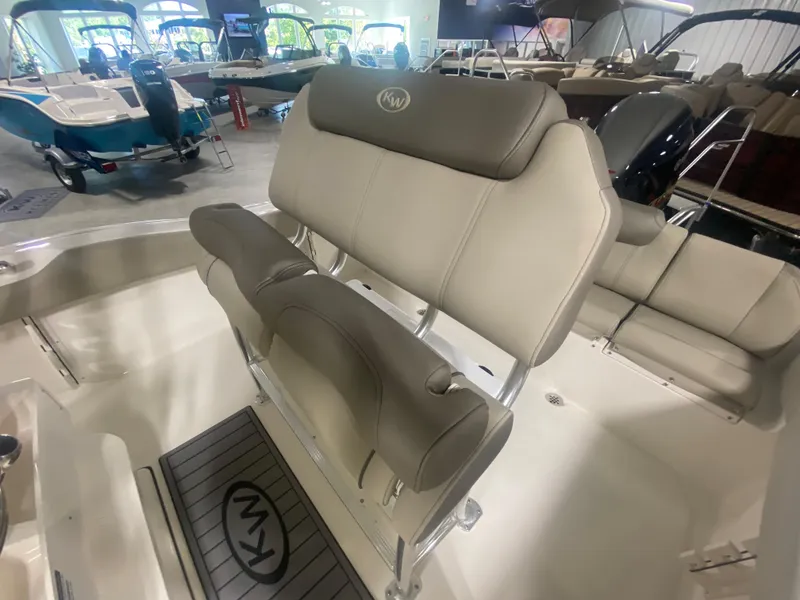 Slide: The Image of 2024 Key West 219 FS boat interior with cushioned seating and modern design. - 9