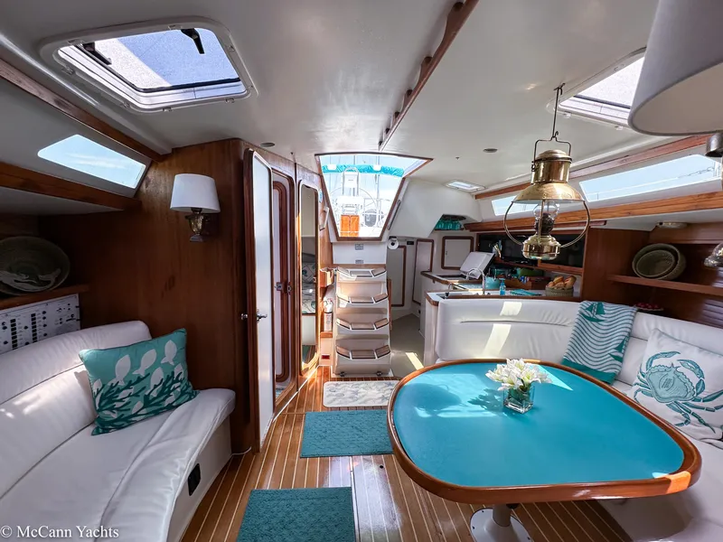 Slide: The Image of Interior of a 1991 Catalina 42 yacht with elegant seating and nautical decor. - 30