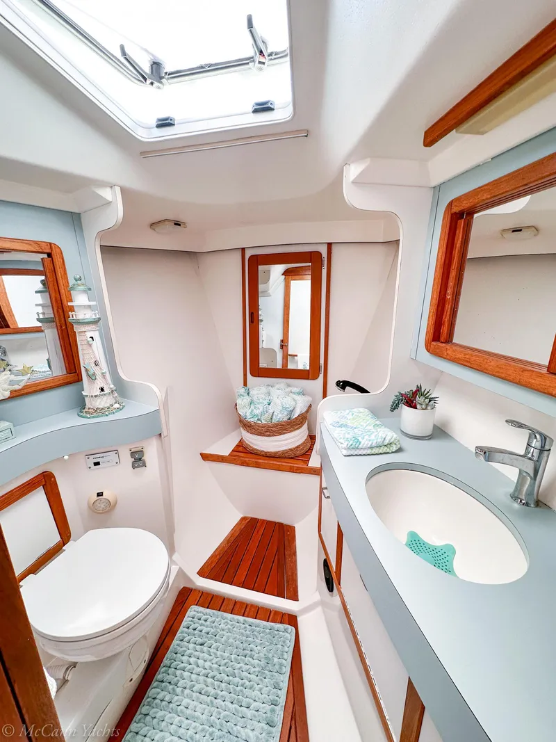 Slide: The Image of Elegant 1991 Catalina 42 yacht bathroom with modern fixtures and wooden accents. - 33