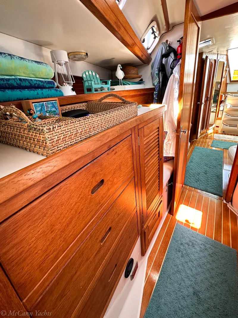 Slide: The Image of Interior of 1991 Catalina 42 yacht with wooden cabinetry and cozy decor. - 38