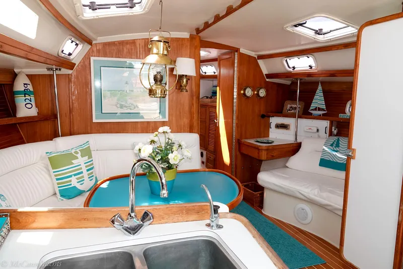 Slide: The Image of Interior of a 1991 Catalina 42 sailboat with cozy seating and nautical decor. - 44