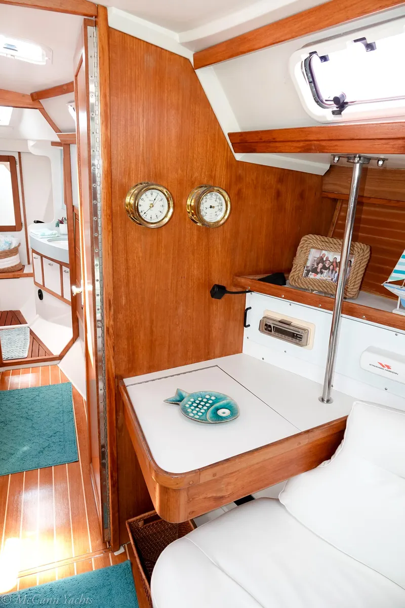 Slide: The Image of Interior of a 1991 Catalina 42 sailboat with wooden accents and nautical decor. - 46