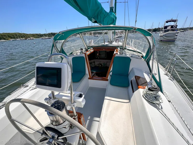 Slide: The Image of Sailing yacht Catalina 42, 1991 model, with spacious cockpit and turquoise accents on a sunny day. - 5