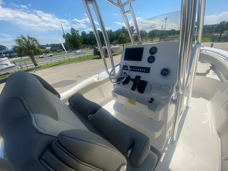 Slide: The Image of 2024 Key West 239 FS boat interior with helm station and seating. - 12