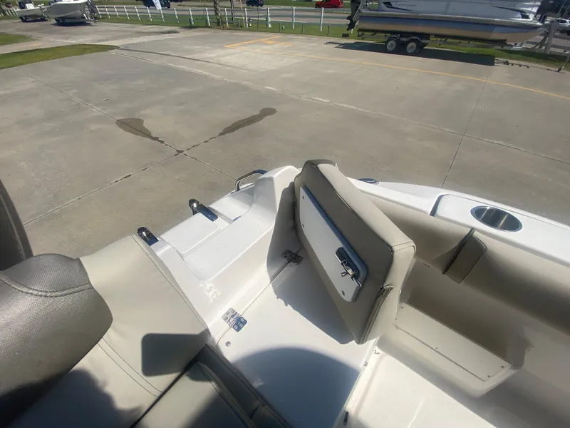 Slide: The Image of 2024 Key West 239 FS boat interior with seating and storage compartments. - 9