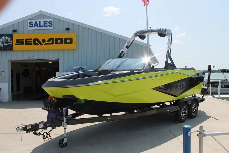Slide: The Image of 2024 Axis T220 boat on trailer outside Sea-Doo sales building. - 3