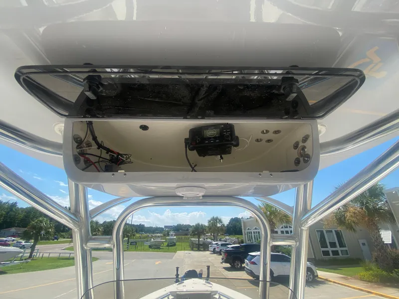 Slide: The Image of 2024 Key West 239 FS boat console with electronics and storage compartment. - 17