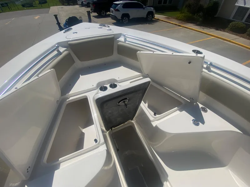 Slide: The Image of 2024 Key West 239 FS boat with open storage compartments. - 20
