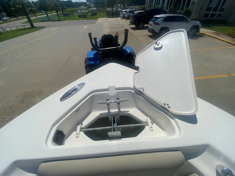 Slide: The Image of 2024 Key West 239 FS boat anchor storage compartment with open lid. - 27