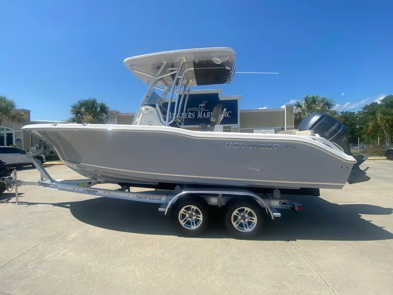 The Image of 2024 Key West 239 FS boat on a trailer, side view, outdoors. - 0