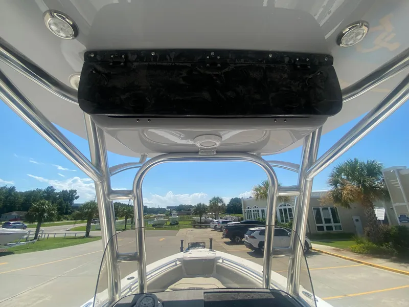 Slide: The Image of 2024 Key West 239 FS boat interior view with T-top and console. - 16