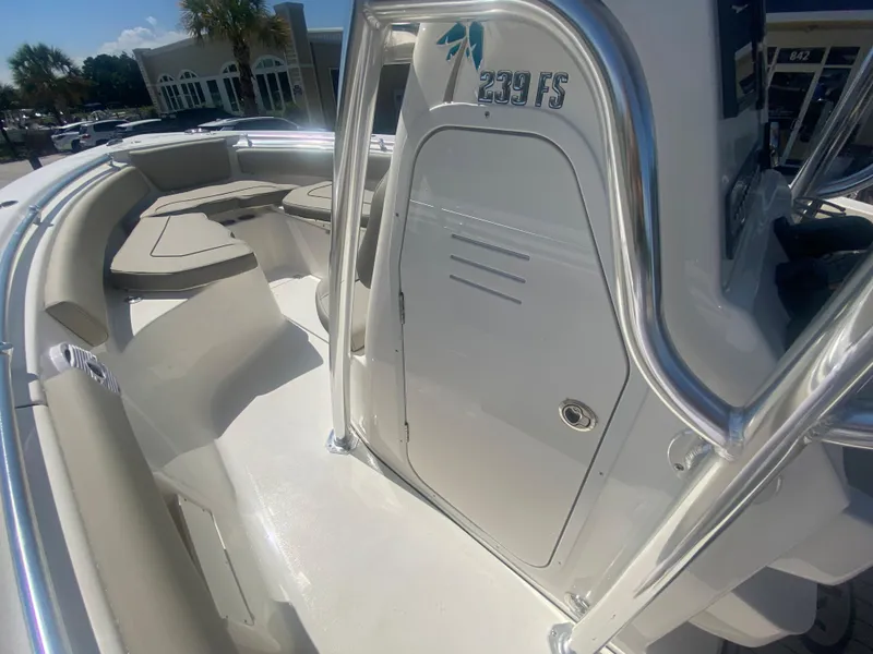 Slide: The Image of 2024 Key West 239 FS boat interior with seating and storage. - 18