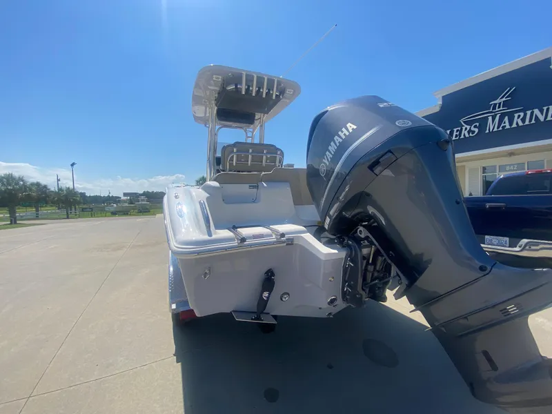 Slide: The Image of 2024 Key West 239 FS boat with Yamaha engine at a marina. - 3