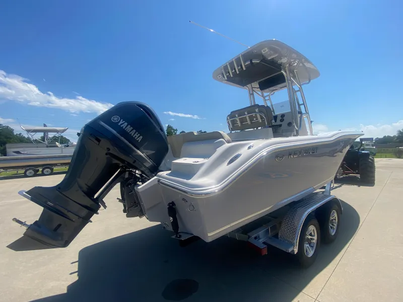 Slide: The Image of 2024 Key West 239 FS boat with Yamaha outboard engine on trailer. - 4