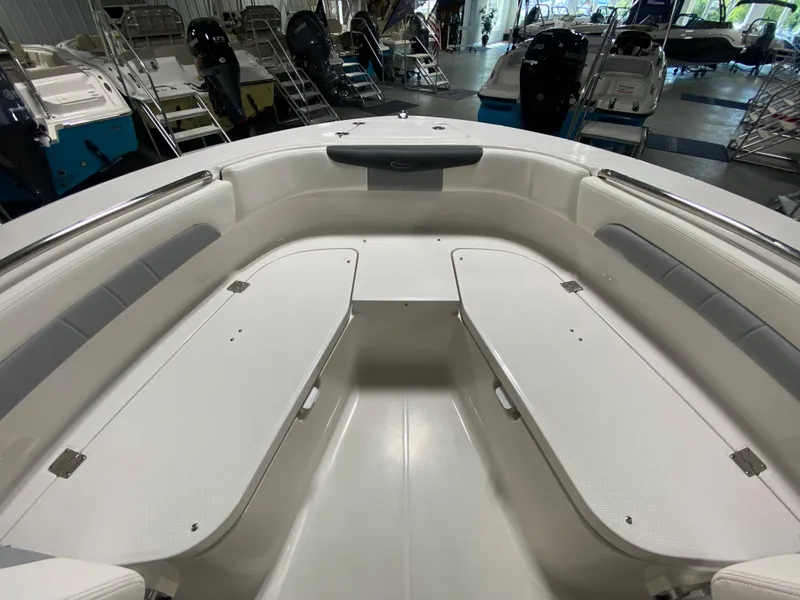 Slide: The Image of 2024 Robalo 202 EXPLORER boat interior, spacious seating and storage compartments. - 17