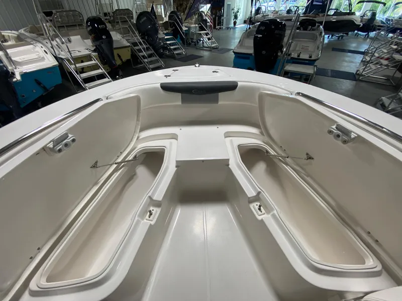 Slide: The Image of 2024 Robalo 202 EXPLORER boat interior with open storage compartments. - 18