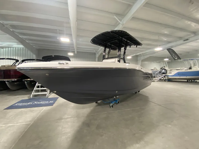 Slide: The Image of 2024 Robalo 202 EXPLORER boat in showroom, side view. - 2