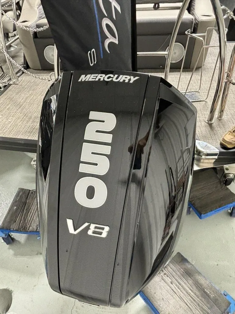 Slide: The Image of 2024 Barletta Corsa 23U with Mercury 250 V8 engine, sleek black design. - 12