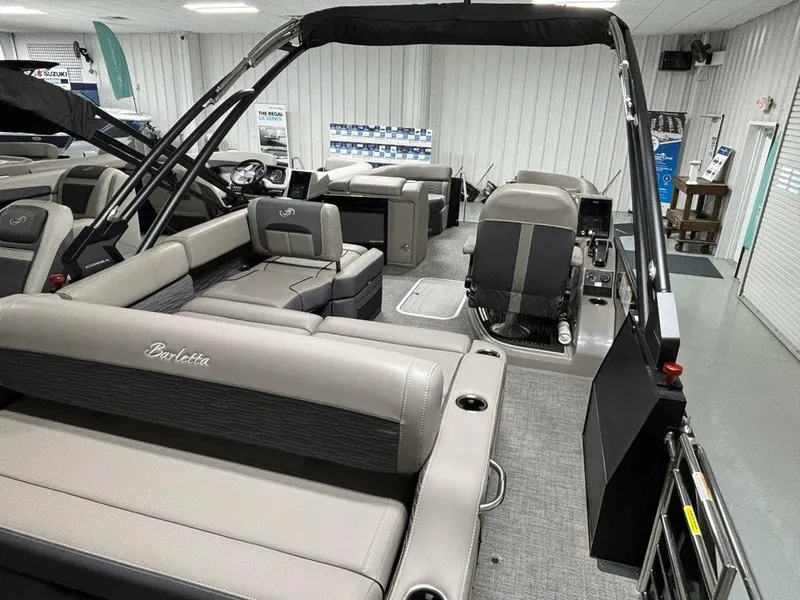 Slide: The Image of 2024 Barletta Corsa 23U pontoon boat interior with luxurious seating and modern design. - 3