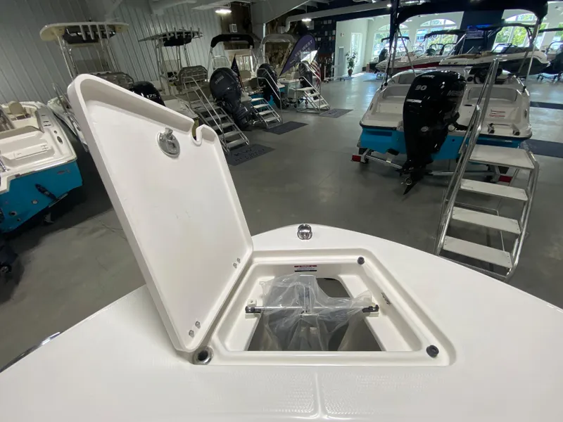 Slide: The Image of 2024 Robalo 202 EXPLORER boat storage compartment open in showroom. - 20