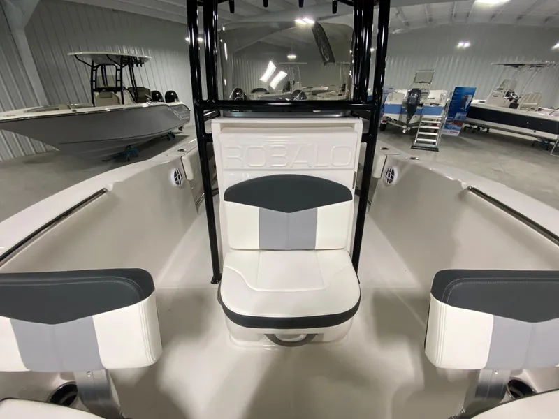 Slide: The Image of 2024 Robalo 202 EXPLORER boat interior with seating in showroom. - 15