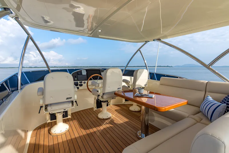 Slide: The Image of Luxurious 2021 Palm Beach Motor Yachts PB65 interior with elegant seating and ocean view. - 13