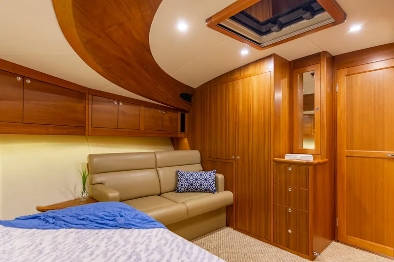 Slide: The Image of Luxurious interior of 2021 Palm Beach Motor Yachts PB65 with elegant wood finish and cozy seating. - 21