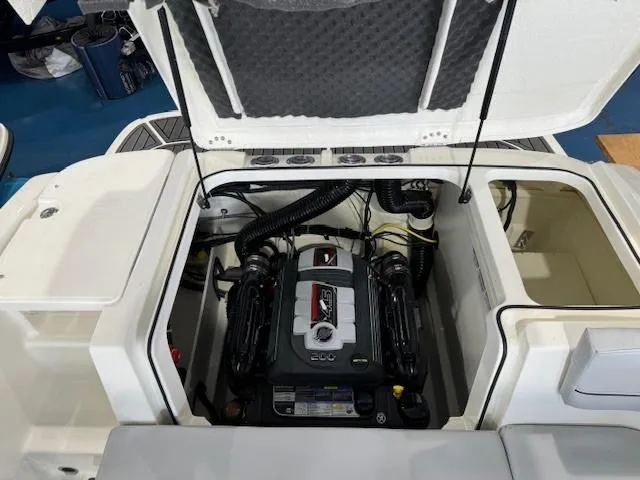 Slide: The Image of 2024 Bayliner VR5 boat engine compartment with open hatch. - 11