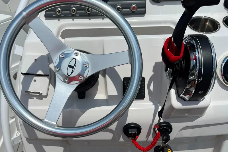 Slide: The Image of 2022 Tahoe 2150 CC boat steering wheel and control panel. - 14